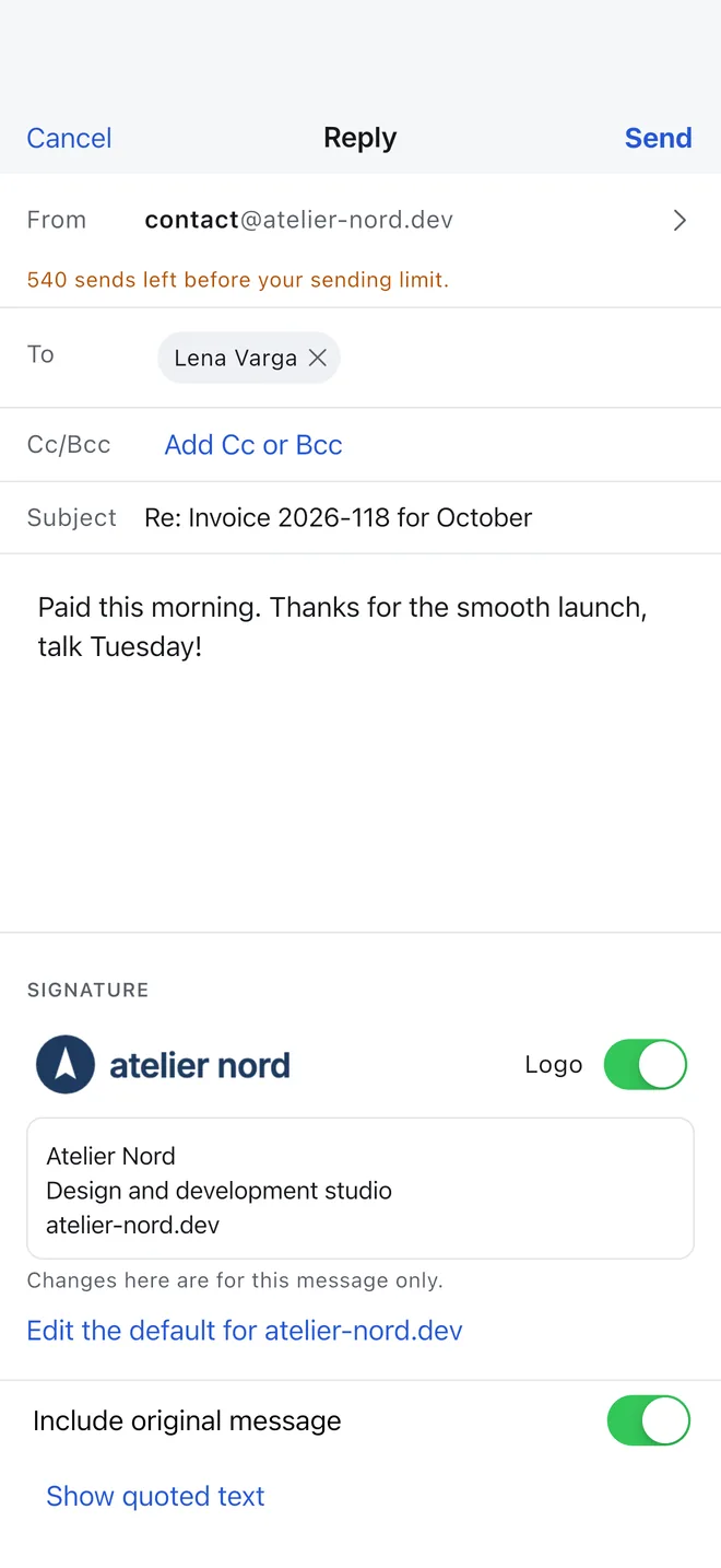 A reply being written from contact@ on the user's domain, with the domain's signature and logo below the text.